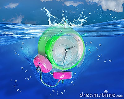 Alarm Clock Sinking. Stock Photo
