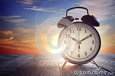 Alarm clock at sunset Stock Photo