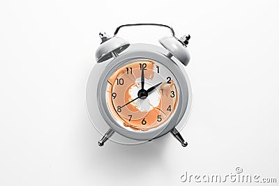 Alarm clock with tone cream instead of the dial. Stock Photo
