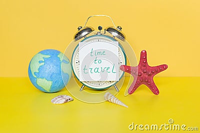 Alarm clock wth words Time to travel Stock Photo