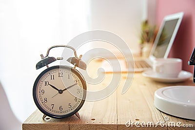 Alarm clock on work tale deadline time business concept. Alarm awake reminder appointment time agenda. selective focus clock on Stock Photo