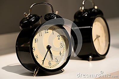 The alarm vintage clocks face on the table Stock Photo