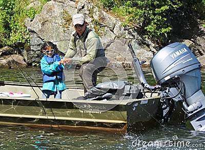 Alaska - Child Fishing, Guide Helping Editorial Stock Photo