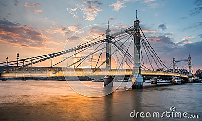 Albert Bridge and beautiful sunset over the Thames, London England UK Editorial Stock Photo