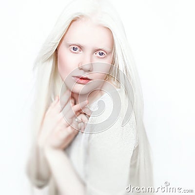 Albino woman with white pure skin and white hair. Photo face on a light background. Portrait of the head. Blonde girl Stock Photo