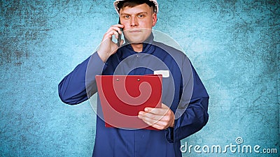 The alchemist checks the test tubes with a test of different compositions, in a white coat, a respirator, goggles, rubber white gl Stock Photo