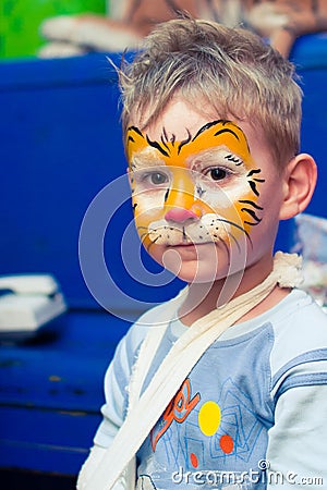 Alchevsk, Ukraine - August 3, 2017: A child draws a face for a children`s party. Aqua makeup for girls and boys. Editorial Stock Photo