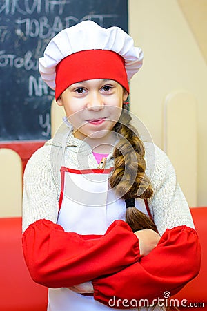 Alchevsk, Ukraine - January 21, 2018: child in the shape of a chef posing Editorial Stock Photo