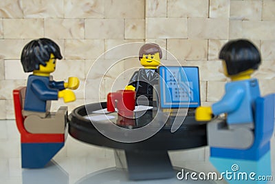 Alcobendas, Spain - May 14, 2018: Working team, working together around a round table. LEGO minifigures concept, Lego minifigures Editorial Stock Photo
