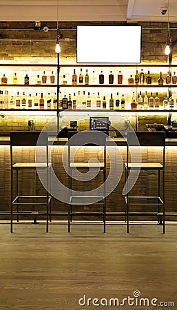 Alcohol bar with chair and blank white screen Editorial Stock Photo