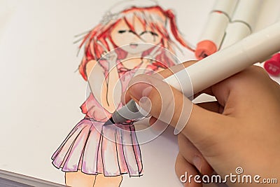 Hand drawing a cute girl anime style sketch with alcohol based sketch drawing markers Editorial Stock Photo