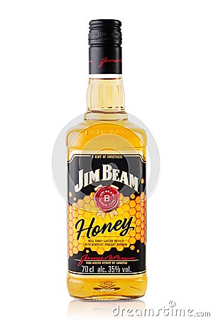 Alcohol bottle - Jim Beam Honey whiskey over a plain white background with reflection. Editorial Stock Photo