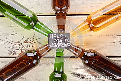 Alcohol dependence concept, wooden table. Stock Photo