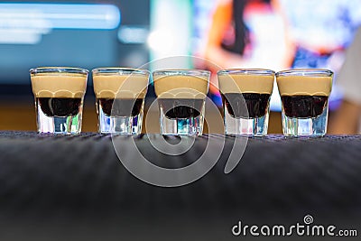 Alcohol shots on ther bar with B52 inside Stock Photo