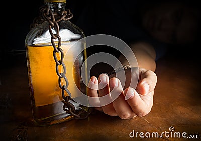 Alcohol slave or Alcoholism Stock Photo