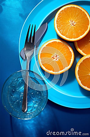 Summer orange fruit cocktail lemon glasses cold refreshing juice blue drink detox Stock Photo