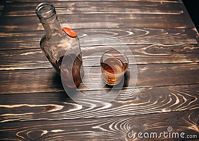 Alcoholic addict. Empty bottle and a glass. Dangerous habit. Unhealthy life concept. Social problem Stock Photo