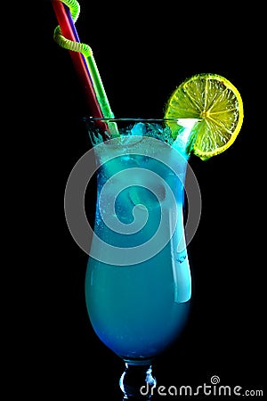 Alcoholic blue cocktails on a black background, in a tall glass Stock Photo