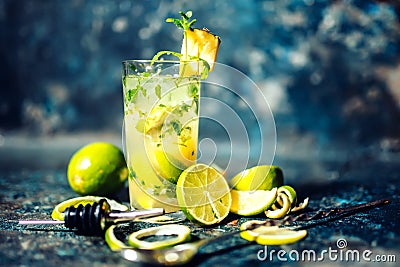 Alcoholic cocktail drink at bar or pub. Gin and lime cocktail with pineapple and ice served cold by bartender Stock Photo