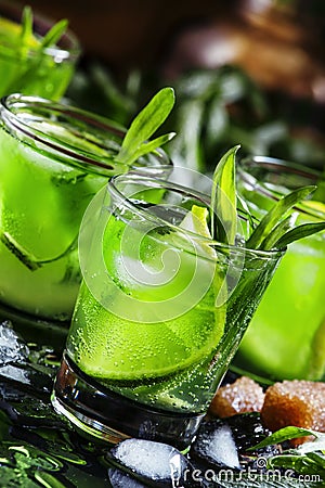 Alcoholic cocktail with lime green, lemon juice, cane sugar, sod Stock Photo