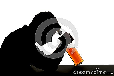 Alcoholic drunk man with whiskey bottle in alcohol addiction silhouette Stock Photo