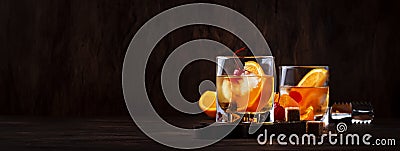 Alcoholic old fashioned cocktail with orange slice, cherry and orange peel garnish Stock Photo