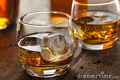 Alcoholic Whiskey Bourbon in a Glass with Ice Stock Photo