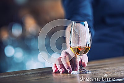 Alcoholism. Hand alcoholic or barman and drink the distillate br Stock Photo