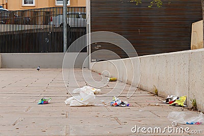 Garbage on the ground in a public park due to the incivility of some people Editorial Stock Photo