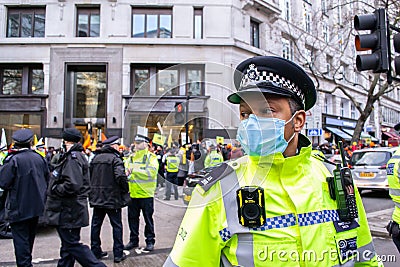 ALDWYCH, LONDON, ENGLAND- 6 December 2020: Police and protesters at the Kisaan protest outside India House Editorial Stock Photo