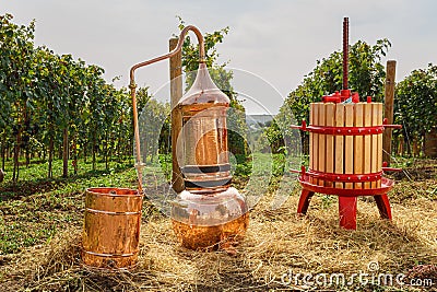 Alembic Copper, barrel and wine press in a vineyard Stock Photo