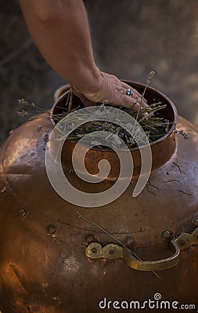 Alembic - copper bowl used for distillation to produce essential oil. Stock Photo