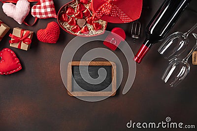 Alentine`s Day with hearts, wine, corkscrew, glasses, gifts, a heart-shaped box and a blackboard Stock Photo