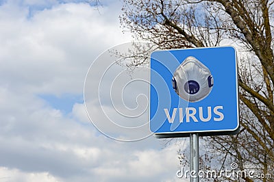 Alert sign with the inscription `virus`and the image of a medical mask Stock Photo