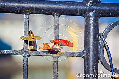 ALESUND, NORWAY, APRIL, 04, 2018: Close up of dozens of padlocks of love on the bridge Editorial Stock Photo