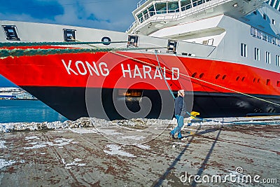ALESUND, NORWAY - APRIL 04, 2018: Outdoor view of Hurtigruten coastal vessel KONG HARALD, is a daily passenger and Editorial Stock Photo
