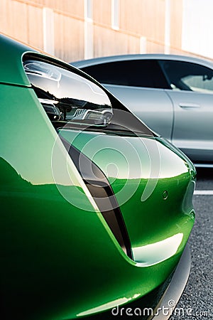 Alesund / Norway - May 31, 2020: Porsche Taycan sedans in a parking lot Editorial Stock Photo