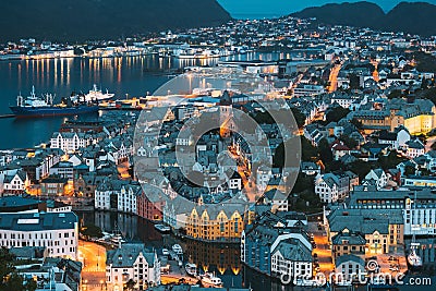 Alesund, Norway. Night View Of Alesund Skyline Cityscape. Historical Center In Summer Evening. Famous Norwegian Landmark Stock Photo