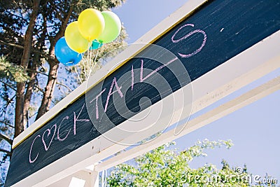Cocktails written on a chalk board banner Stock Photo