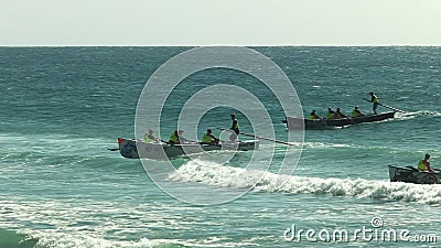 ALEXANDRA HEADLAND, QUEENSLAND, AUSTRALIA- APRIL 21, 2016: wide angle view of several surf boats finishing a race Editorial Stock Photo