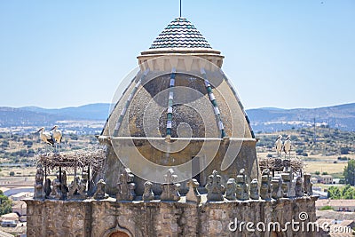 Alfiler tower, Gothic belfry adorned with glazed roof tiles, Trujillo, Spain Stock Photo