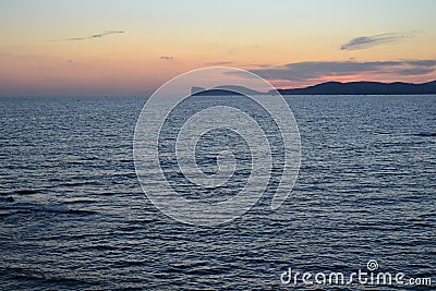 Alghero coastline at twilight -Sardinia, Italy Stock Photo