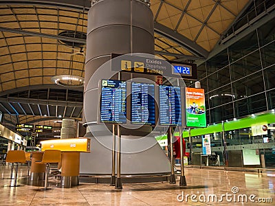 Alicante airport interior, showing the departure waiting area and timetable for flight gates. Editorial Stock Photo