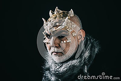 Alien, demon, sorcerer makeup. Senior man with white beard dressed like monster. Demon on black background, copy space Stock Photo