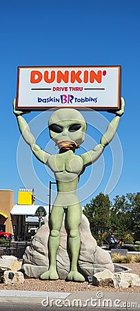 Alien holding the Dunkin and Baskin Robbins sign Roswell New Mexico Editorial Stock Photo