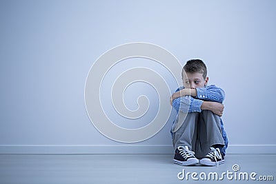 Sad alienated child with autism Stock Photo