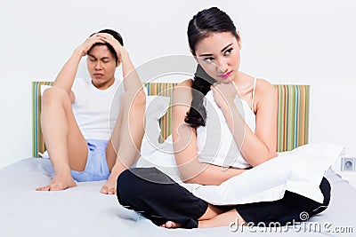 Alienated Chinese couple, woman is rejecting her man Stock Photo