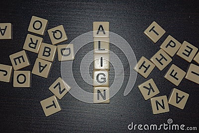Align tile letters on black background with mixed letters on either side. Concept for business, personal or other goal-setting i Stock Photo