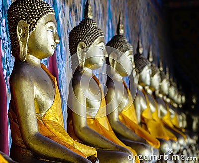 Aligned gold buddha Stock Photo