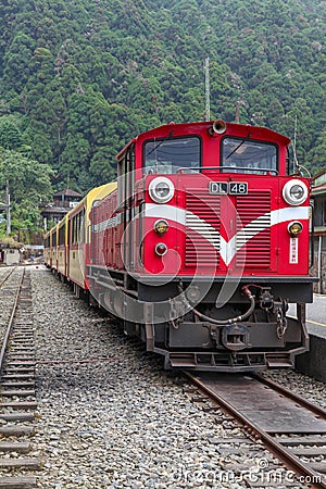 Alishan,taiwan-October 15,2018:The old red Train in Alishan Line come back to Chiyi train station at foggy day Editorial Stock Photo